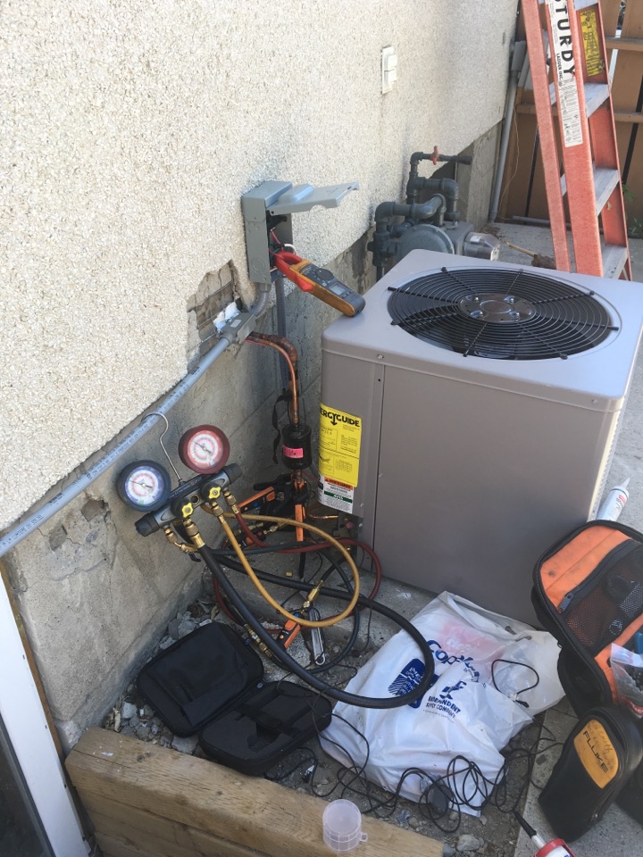 Stanley Park, AB - Installing 2.4 ton condenser  Stanley Park, AB - Installing 2.4 ton condenser